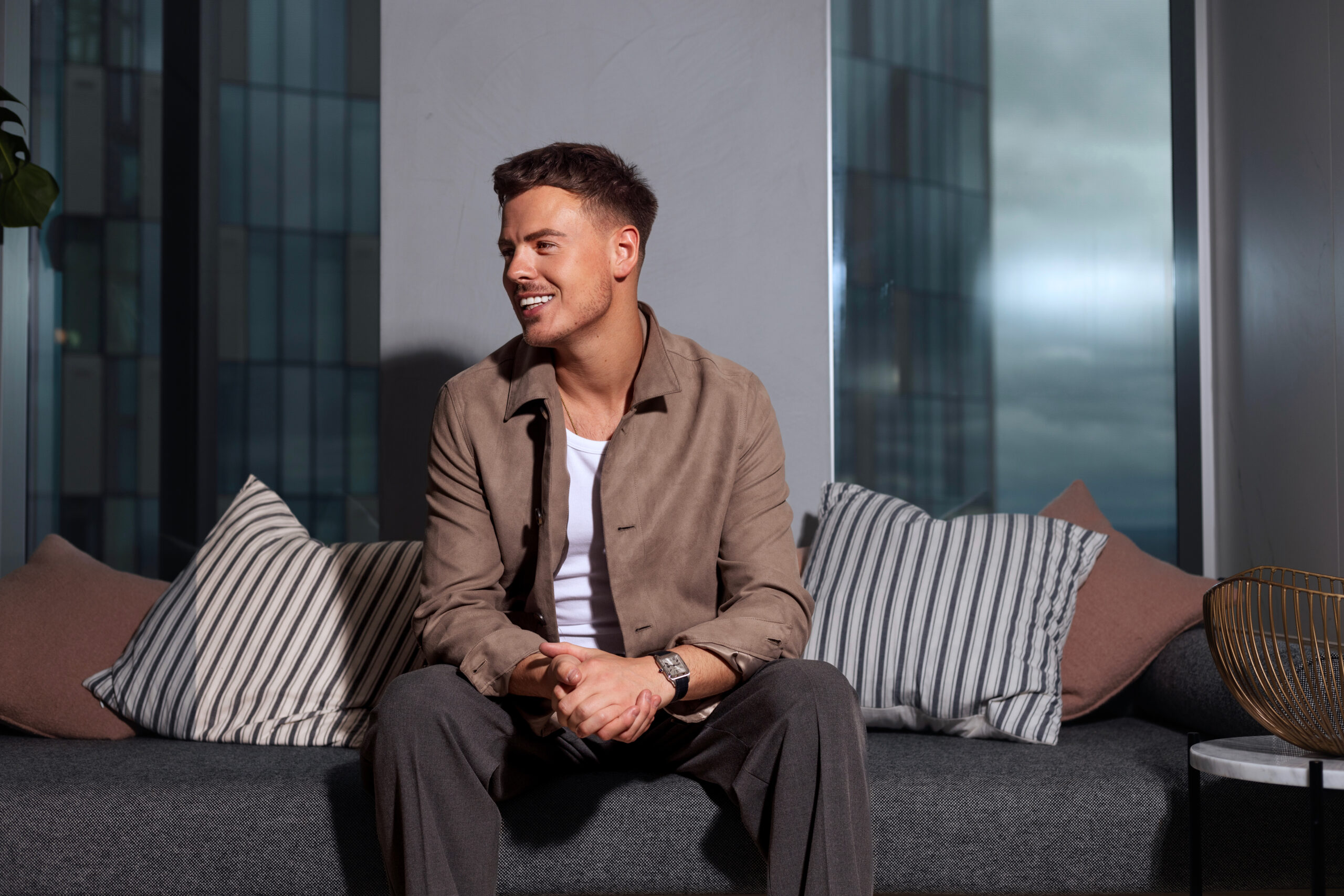 James Blake Presenter on a sofa